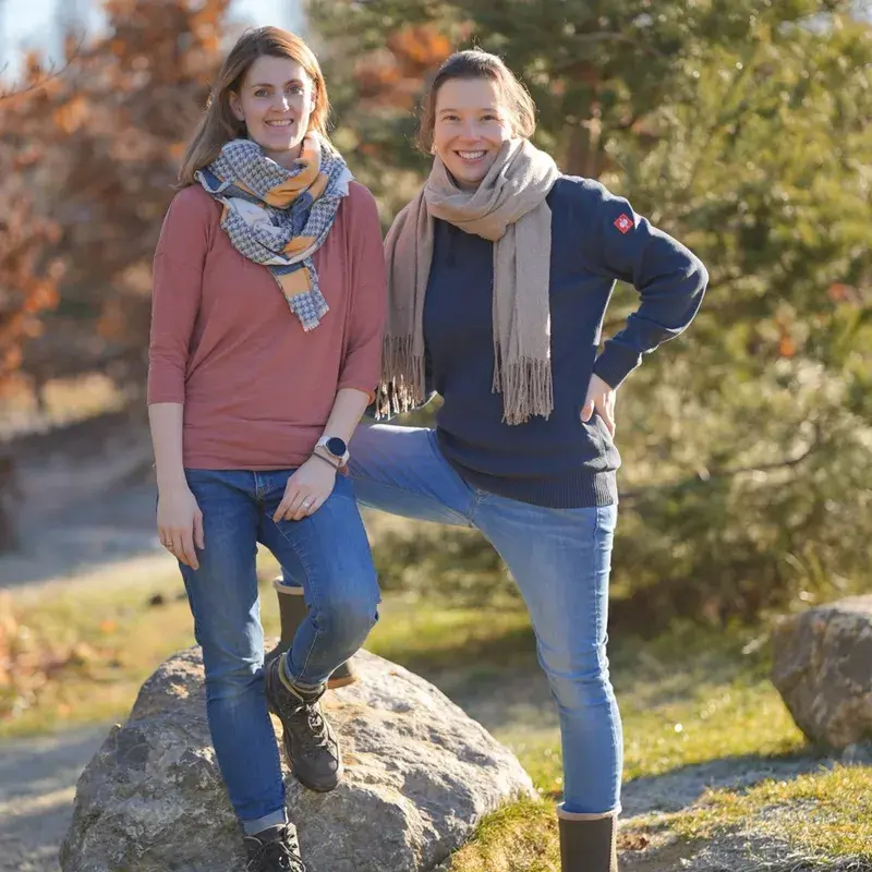 The PerformaNat founders Julia and Katharinas are standing amiably in nature on a rock. They are passionate about research & animal health. The PerformaNat founders Julia and Katharinas are standing amiably in nature on a rock. They are passionate about research & animal health.